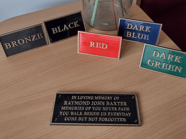 Bronze plaques on wooden table